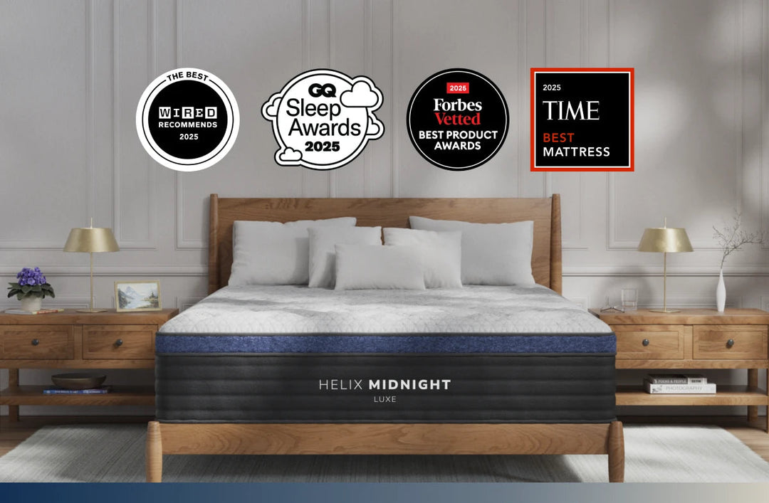 Helix Midnight mattress with multiple awards on a gray wall background